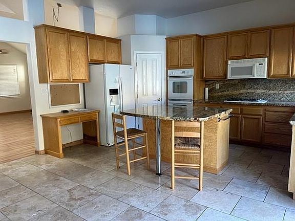 Kitchen desk and new fridge, walk in pantry