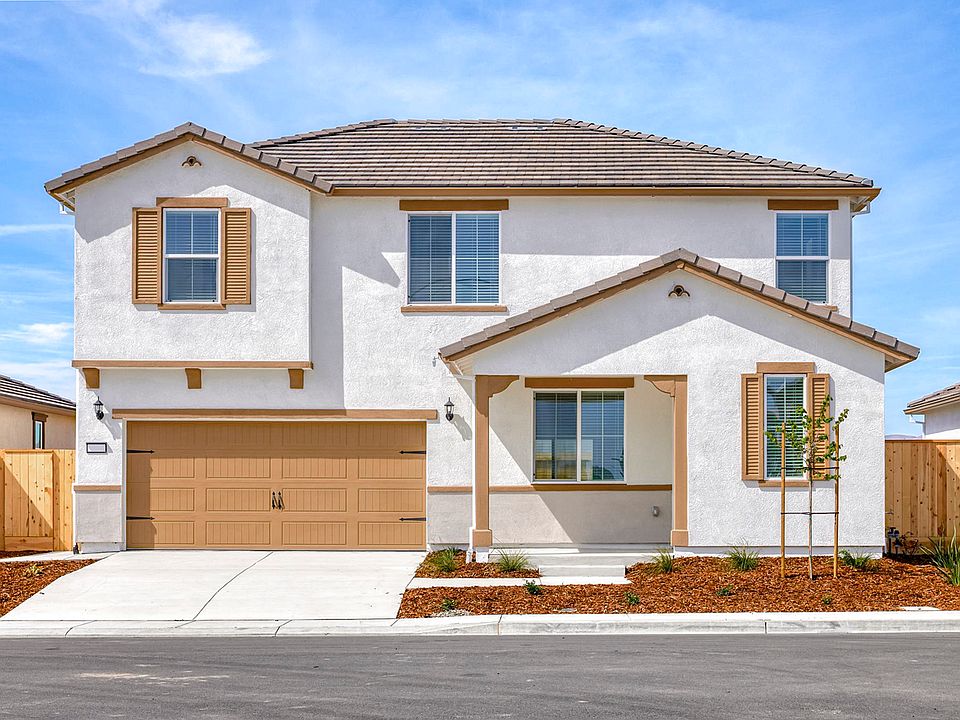 The Nelson is a beautiful two story home with stucco and stone.