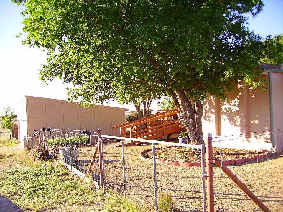 Front yard + side of hanger