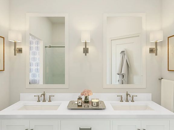 Primary bath with white-framed mirrors