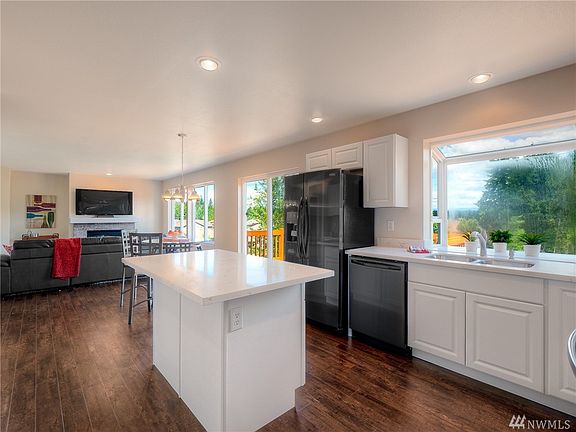 Light filled kitchen open to the family room.