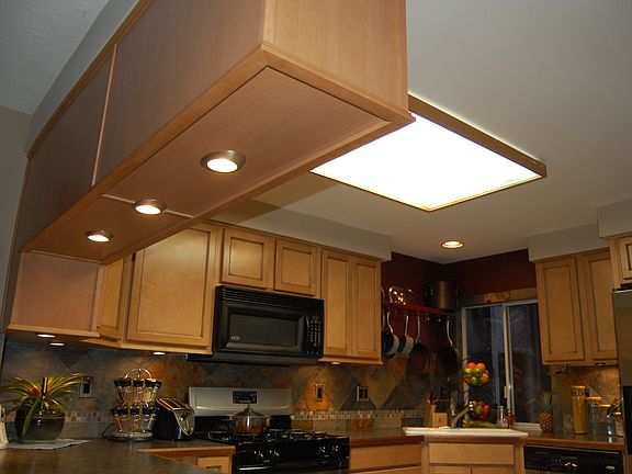 Custom lighting and slate backsplash