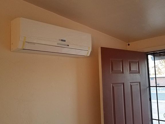 Minisplit cooling/heating unit in living room. Each room in the house has one of these units.