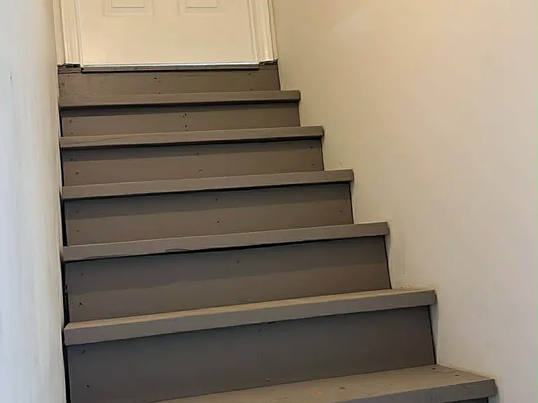 Stairs to garage from living area