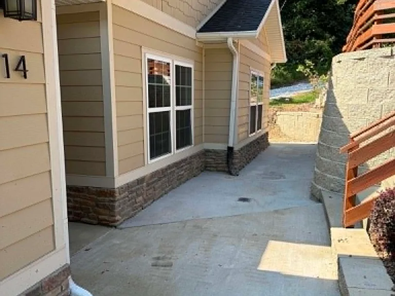 Newly laid concrete pathway in front of home