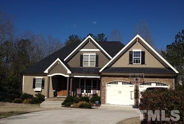 Your new home on Fawn Lily Drive - large paverstone patio with fire pit, yard storage under deck, walking trails to greenway directly across the cul-de-sac.