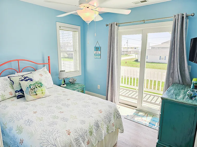 Queen Bedroom, downstairs. Balcony attached to room. TV included