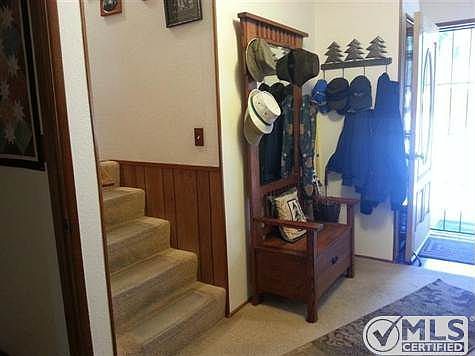 Entry and half stairs to two bedrooms and bath.