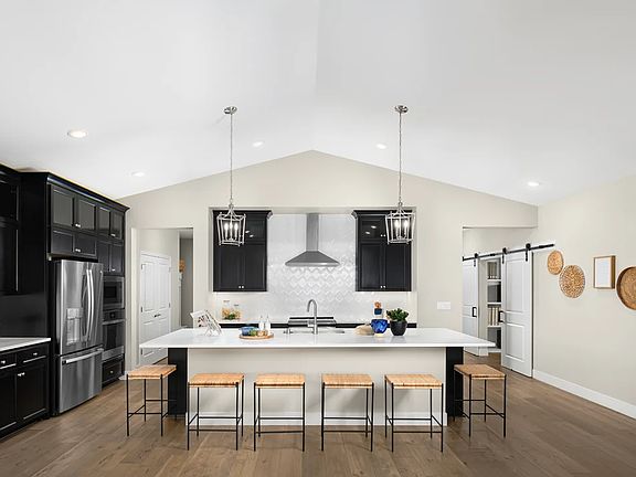 Kitchen with pendant lighting and vaulted ceiling