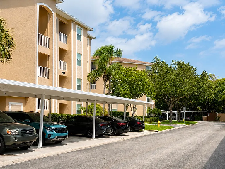 Beautifully maintained community with covered parking and lush tropical landscaping