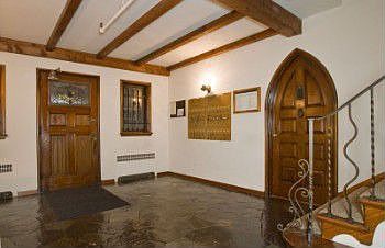 Lobby showing original Anhalt signature arched door 