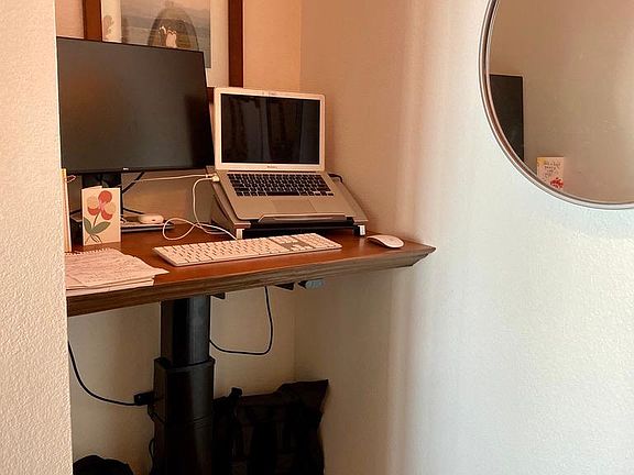 Built in sit-stand desk for working at home. Can be removed and turned into a reading nook.