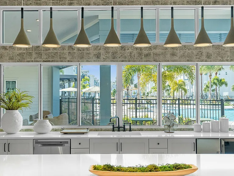 Experience culinary delight with a stunning poolside view that brings nature into your kitchen.
