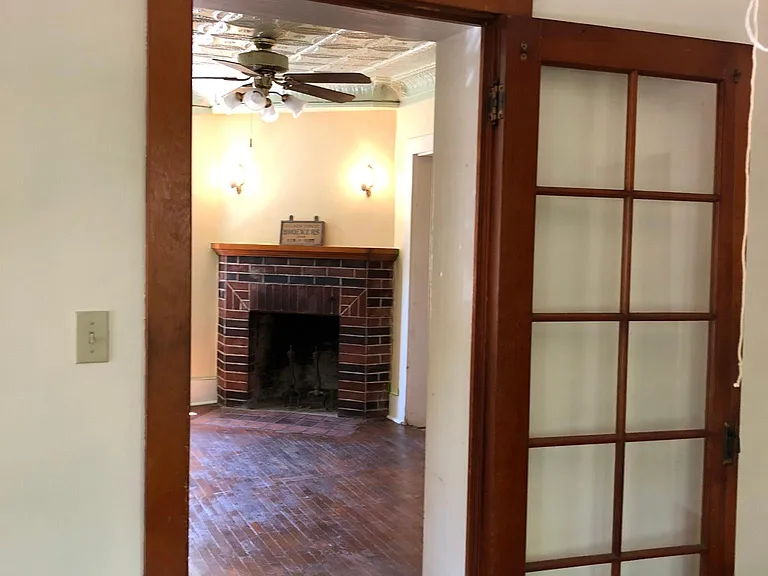 View from office toward decorative fireplace downstairs