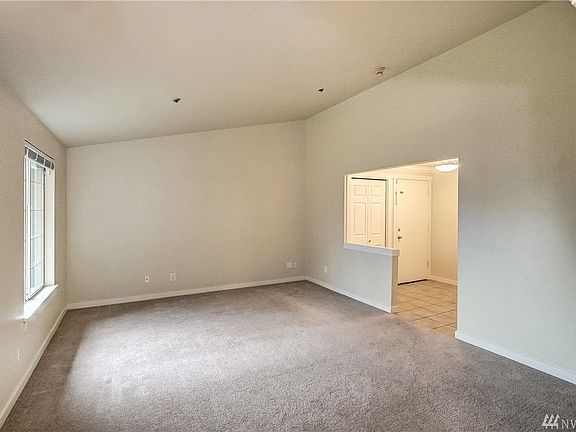 A nice large living room with vaulted ceiling. 
