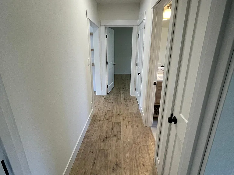 Hall way connecting bedrooms, bath and living space