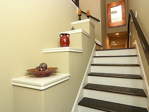 Hand-scraped hardwood floors in the entry and stairs.