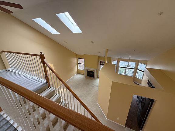 View from Loft to Living Room with Sky Lights
