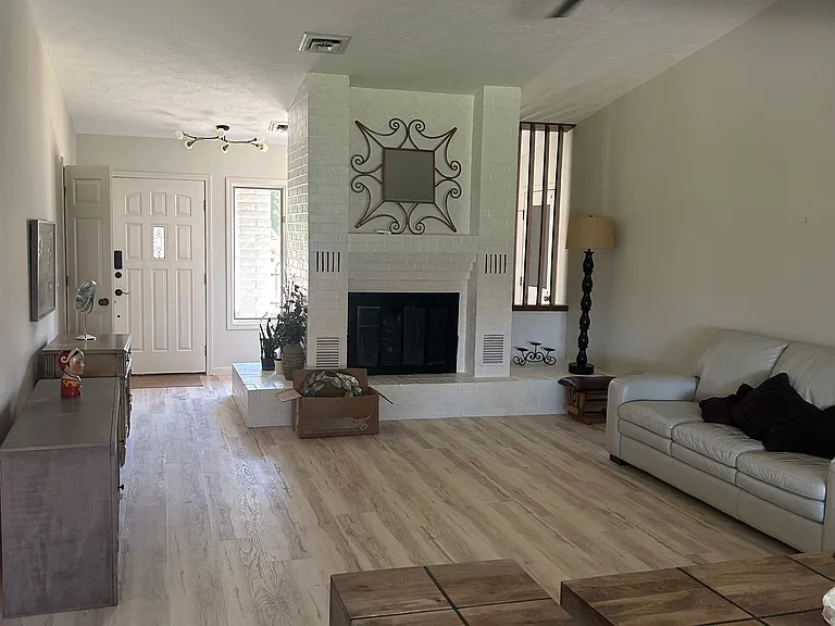 Beautiful large living area with natural gas remote fireplace for those cool mornings, very nice modern style