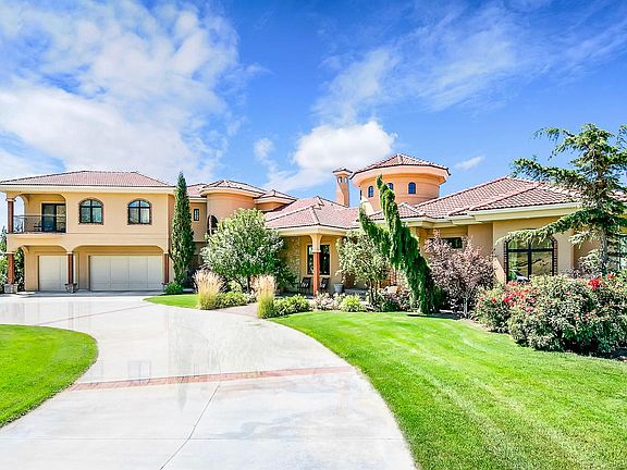 huge circular driveway with spacious 3-car garage
