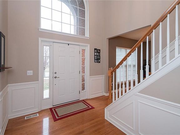 Grand Two Story Entry Way welcomes you. Entry flanked by the formal dining room and private office. Gleaming hardwood floors throughout the main floor.