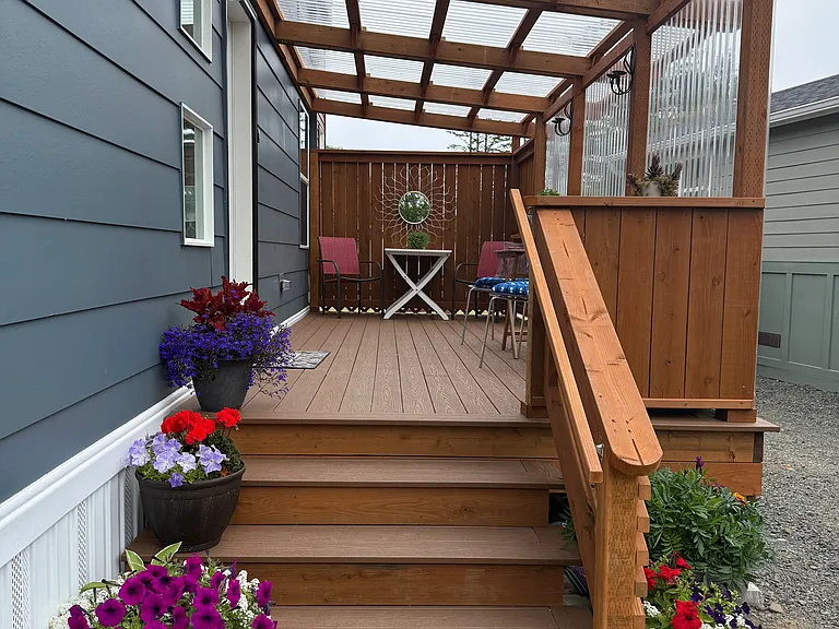 patio with stairs to driveway