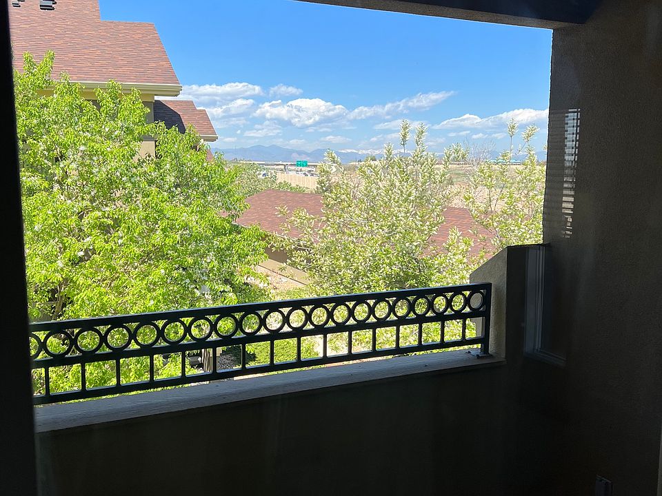 Looking out to the balcony with mountain views in the background.