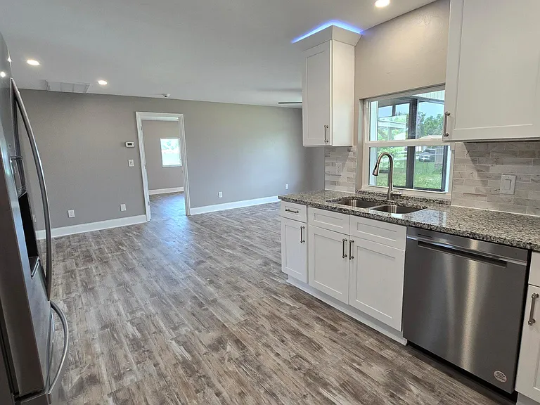 Kitchen opens to the dining and second family room.