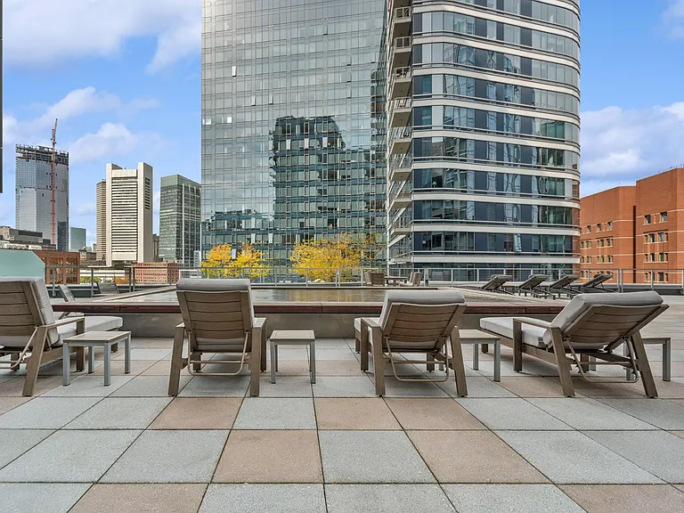 Sun Deck Lounging Area with Cityscape Views