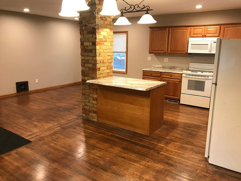 Main floor open dining, living room, and kitchen area. Beaut