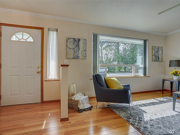 Enter to gleaming hardwood floors and this cozy living room.