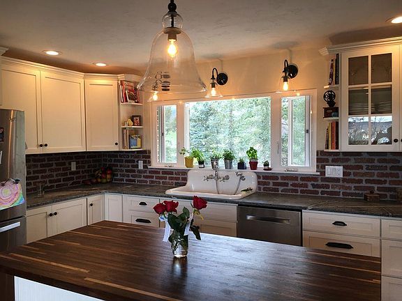 Soapstone countertops, butcher block island with extra storage, and quiet close cabinets!