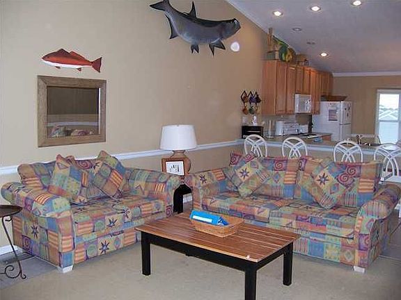 Living Room - located on top level, spacious exterior deck