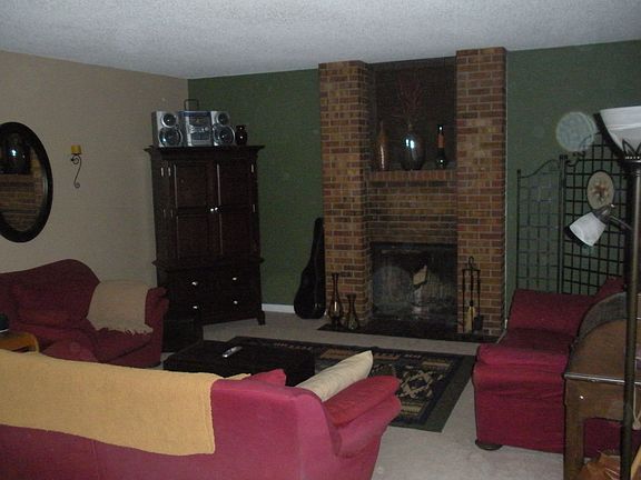 Family room with fireplace and sliding glass doors