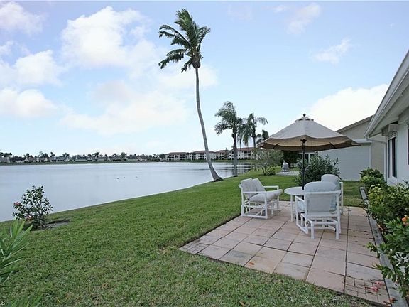 View from side yard of the patio & lake view.
