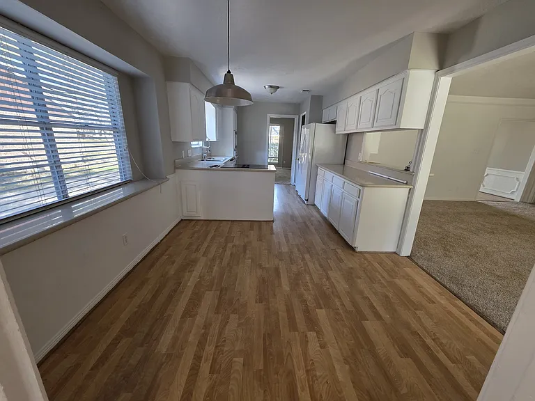 Spacious, open kitchen with tons of cabinet storage. Breakfast area off kitchen for morning coffee.