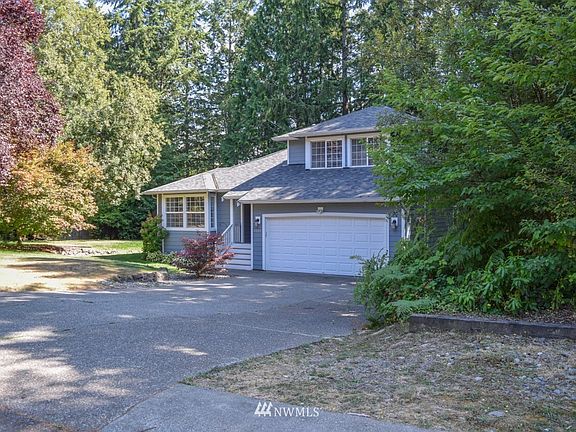 Nestled in a beautiful landscaped yard