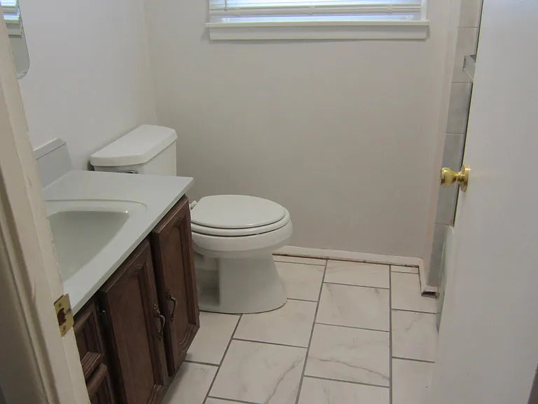 The top level full bath, the shower is behind the door.