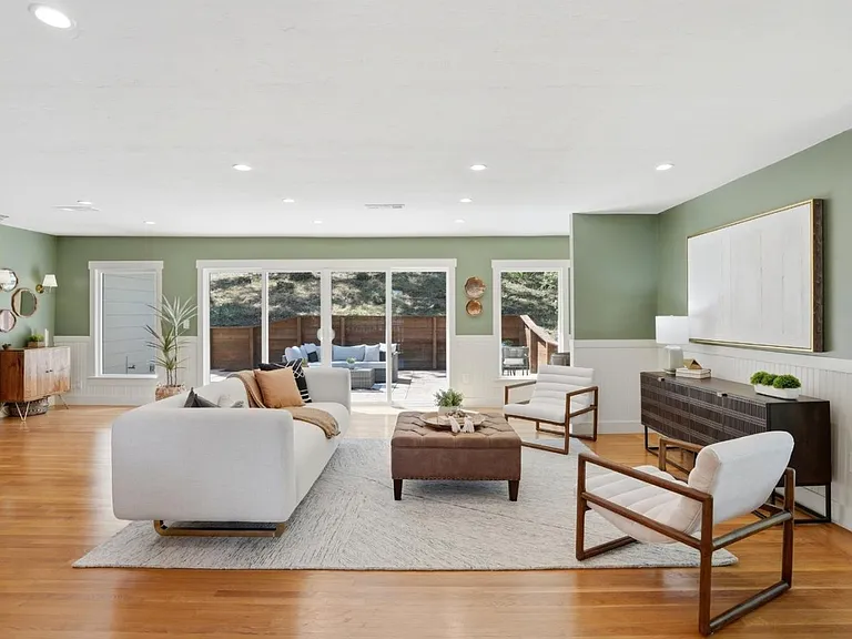 Bright open-concept living with seamless indoor-outdoor flow and peaceful backyard views