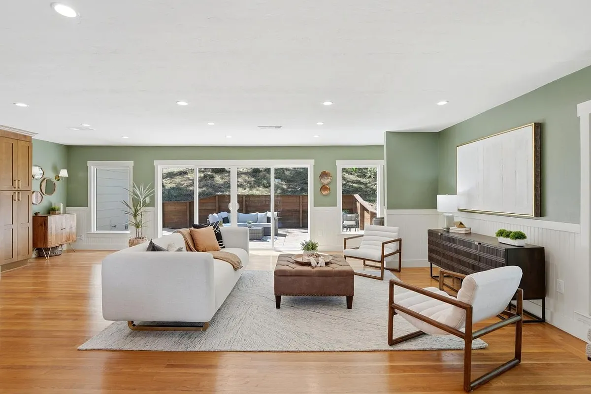 Bright open-concept living with seamless indoor-outdoor flow and peaceful backyard views - Hacienda Dr