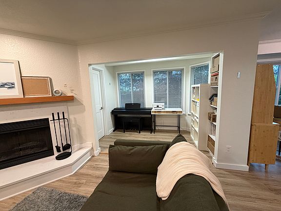 Nook off of living room with a storage closet