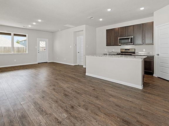 Dining Area to Kitchen and Family Room