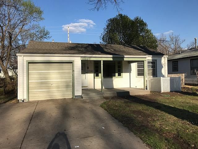 Front with extra wide driveway