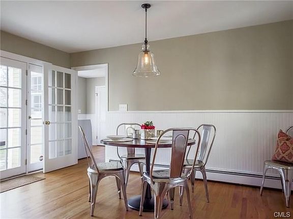 Kitchen has breakfast area with french doors leading to blue stone patio