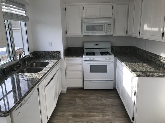 Kitchen new granite tops double sink built in microwave . new refrigerator
