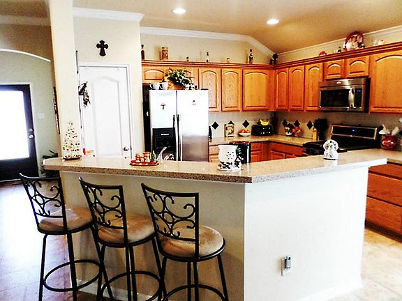 Breakfast bar and tile floors throughout kitchen!
