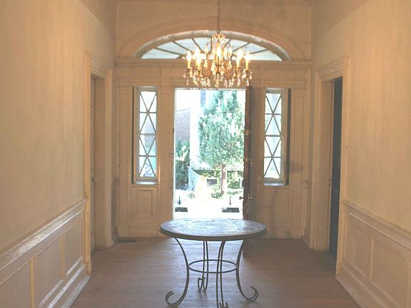 Front hall 9 feet across fanlight over door mahogany bannister in foreground