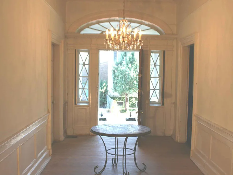 Front hall 9 feet across fanlight over door mahogany bannister in foreground