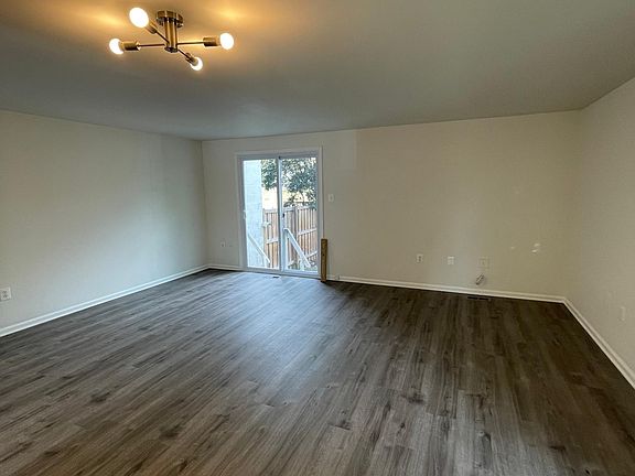 Living Room with access to fenced back yard