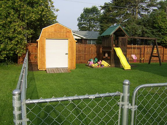 Beautiful back yard with Wood Swing Set Included.